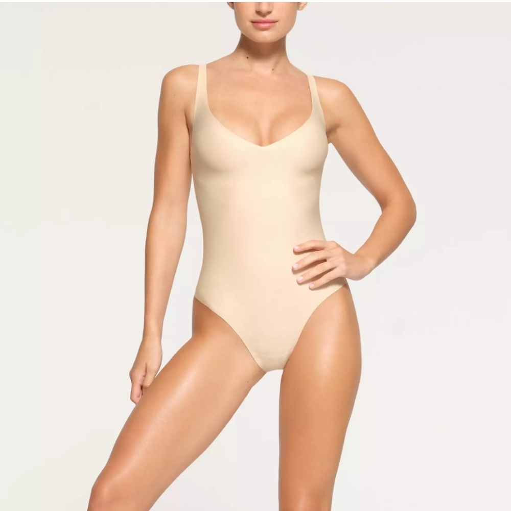 Skims Body Unlined Plunge Thong Bodysuit - Sand